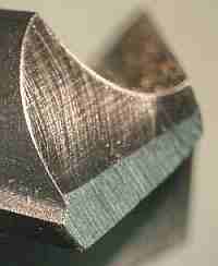 Drill bit with facet